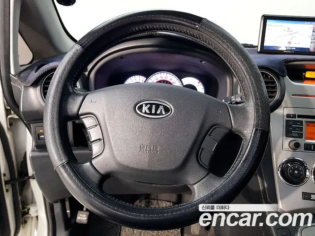 Kia Carens 2010 — фото 10