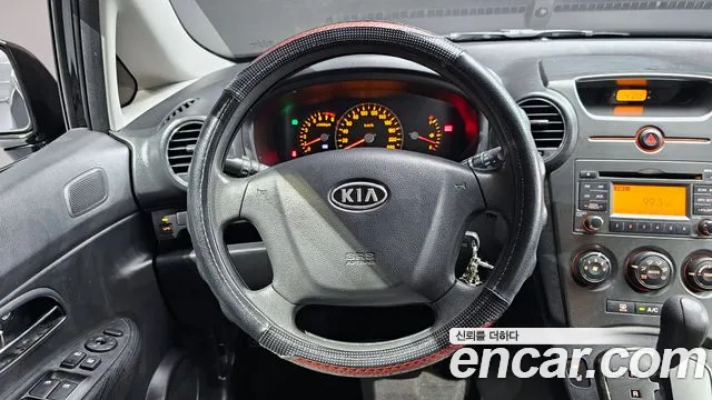 Kia Carens 2011 — фото 13